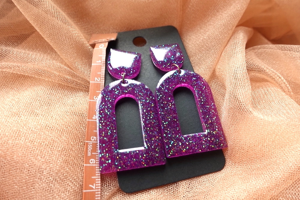 Glitter oorbellen (paars en groen)