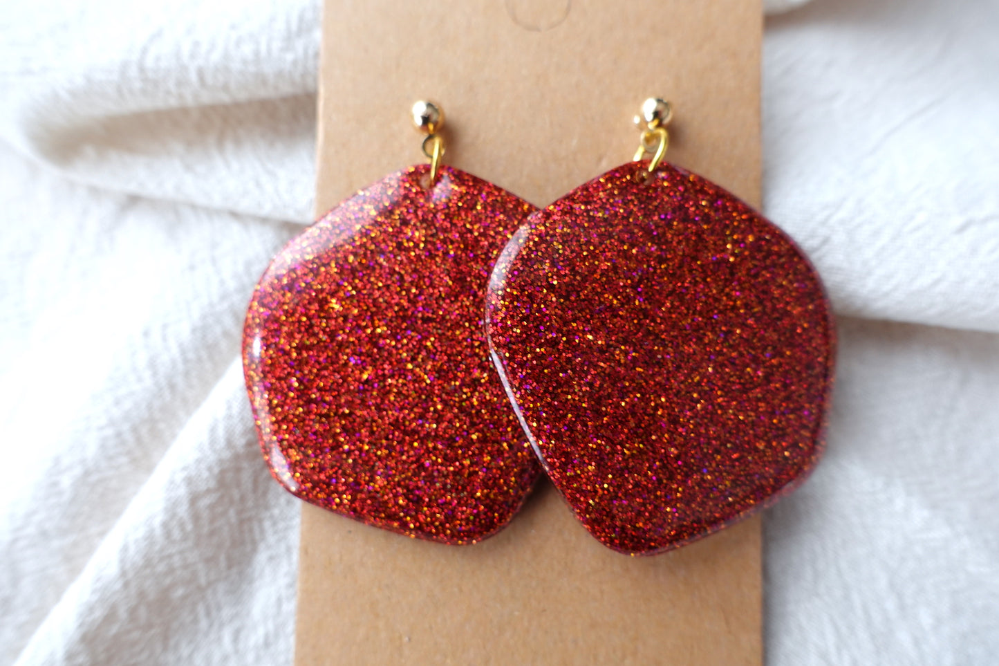Organische vorm rode-oranje oorbellen glitter oorbellen - statement oorbellen