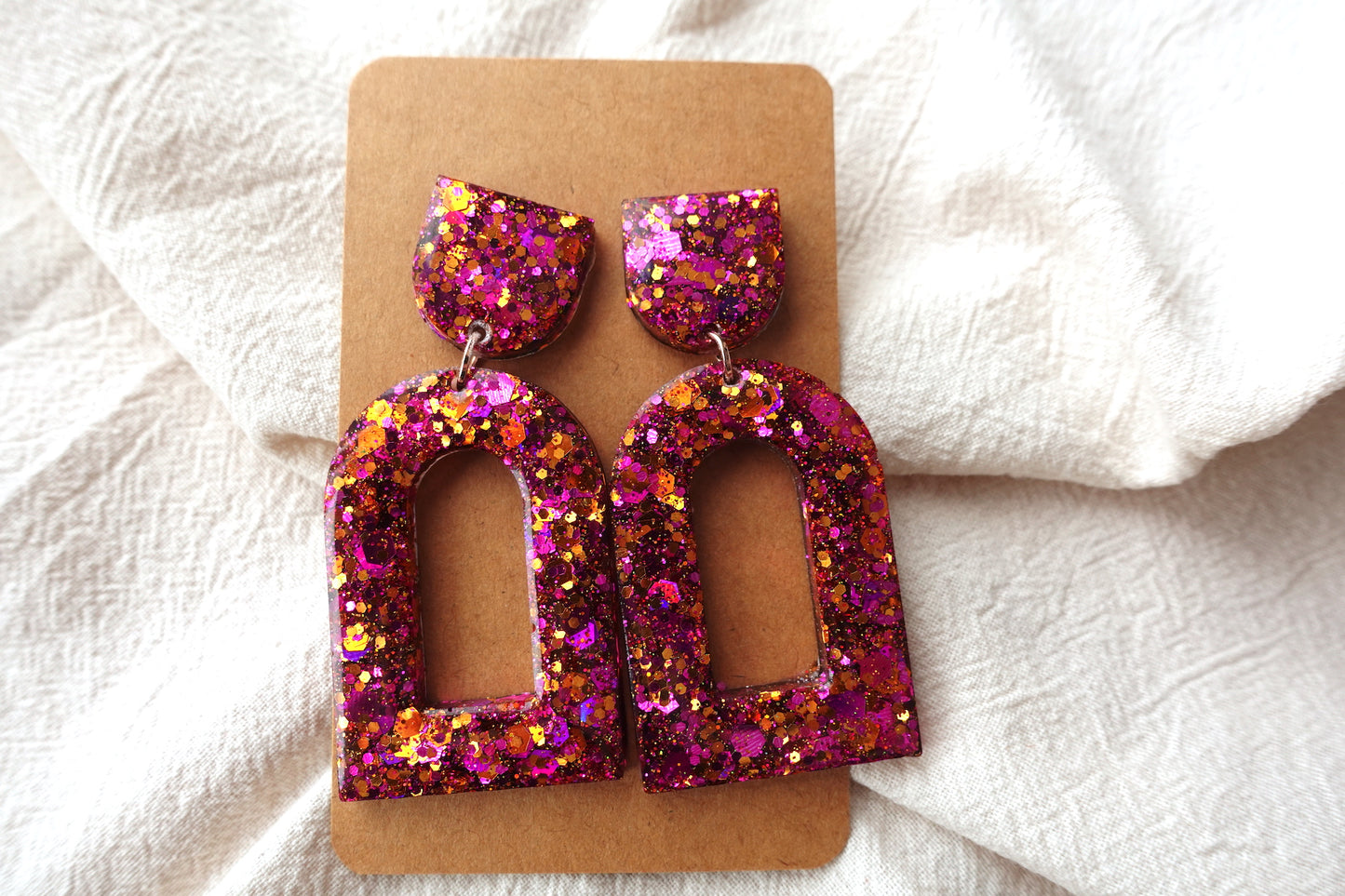 Boog oorbellen roze en oranje glitter oorbellen  - statement oorbellen