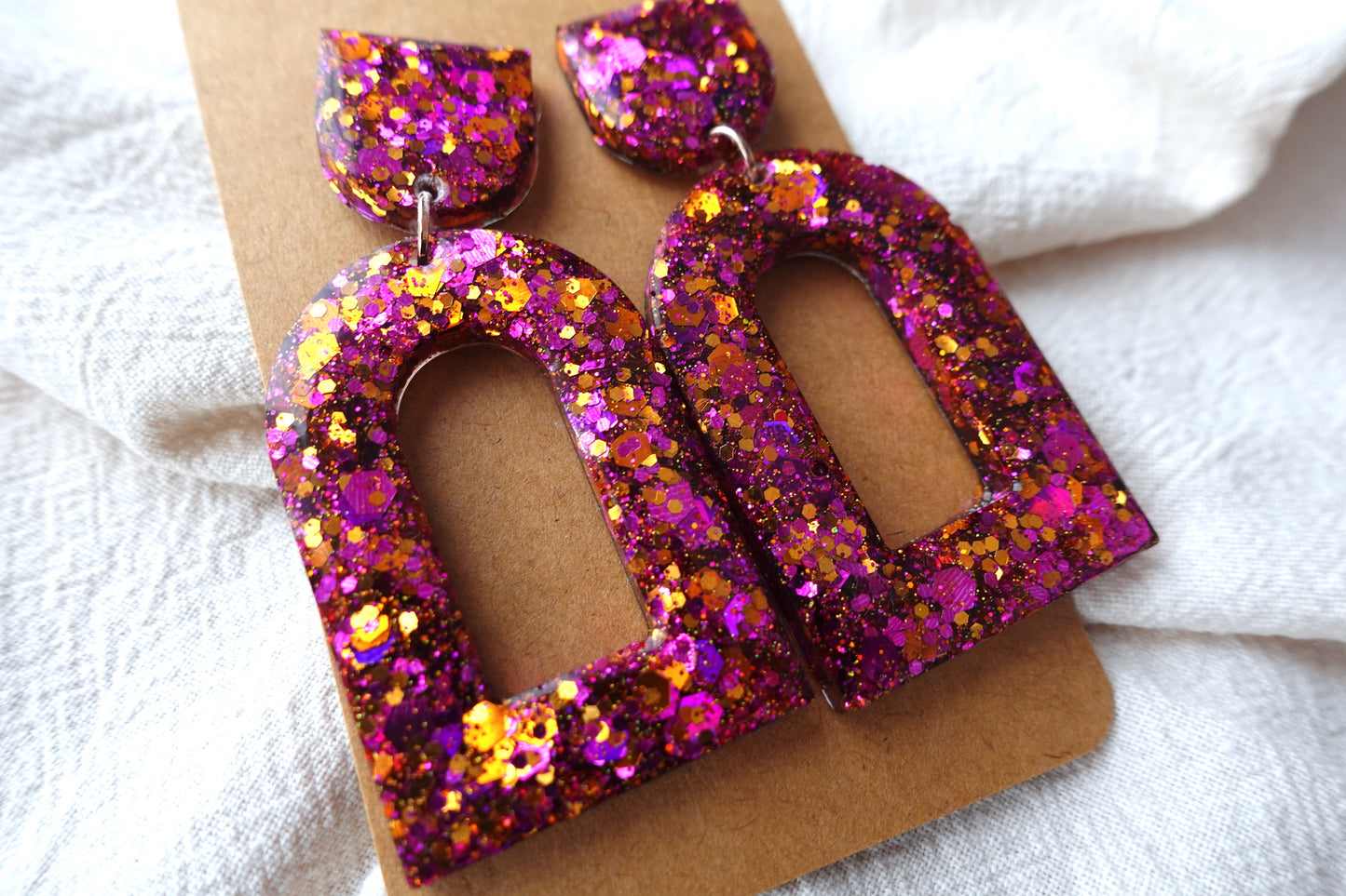 Boog oorbellen roze en oranje glitter oorbellen  - statement oorbellen