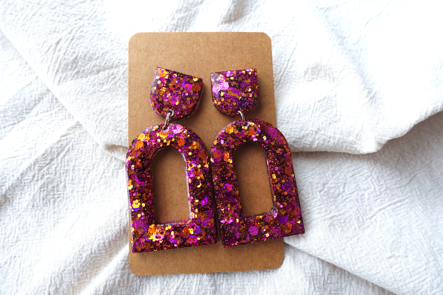 Boog oorbellen roze en oranje glitter oorbellen  - statement oorbellen